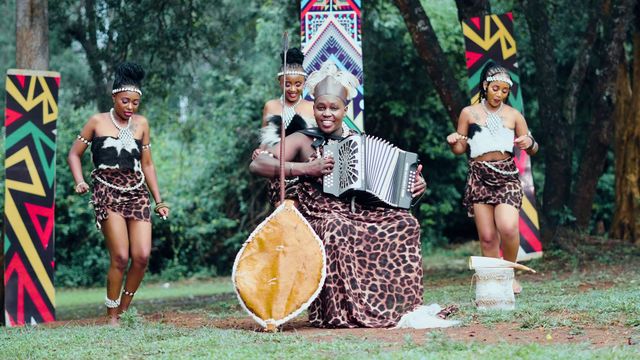 Dancers and accordion player filmed in the forest