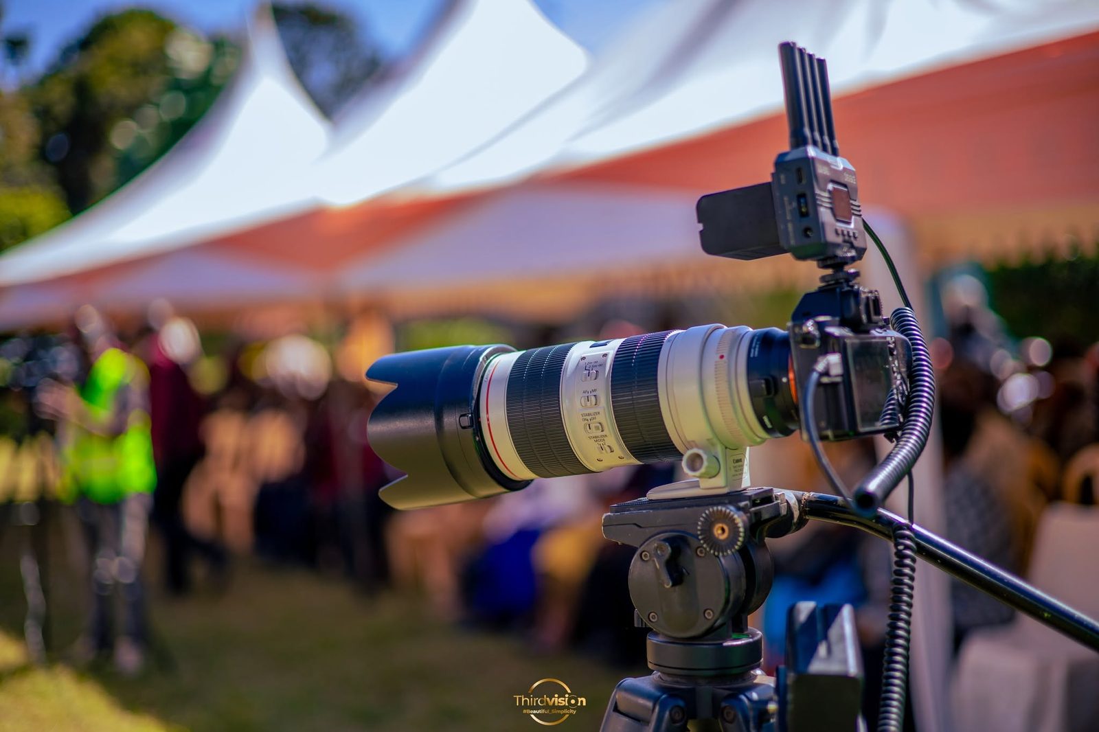 Camera with a long lens covering an event for a Third Vision Studios livestream
